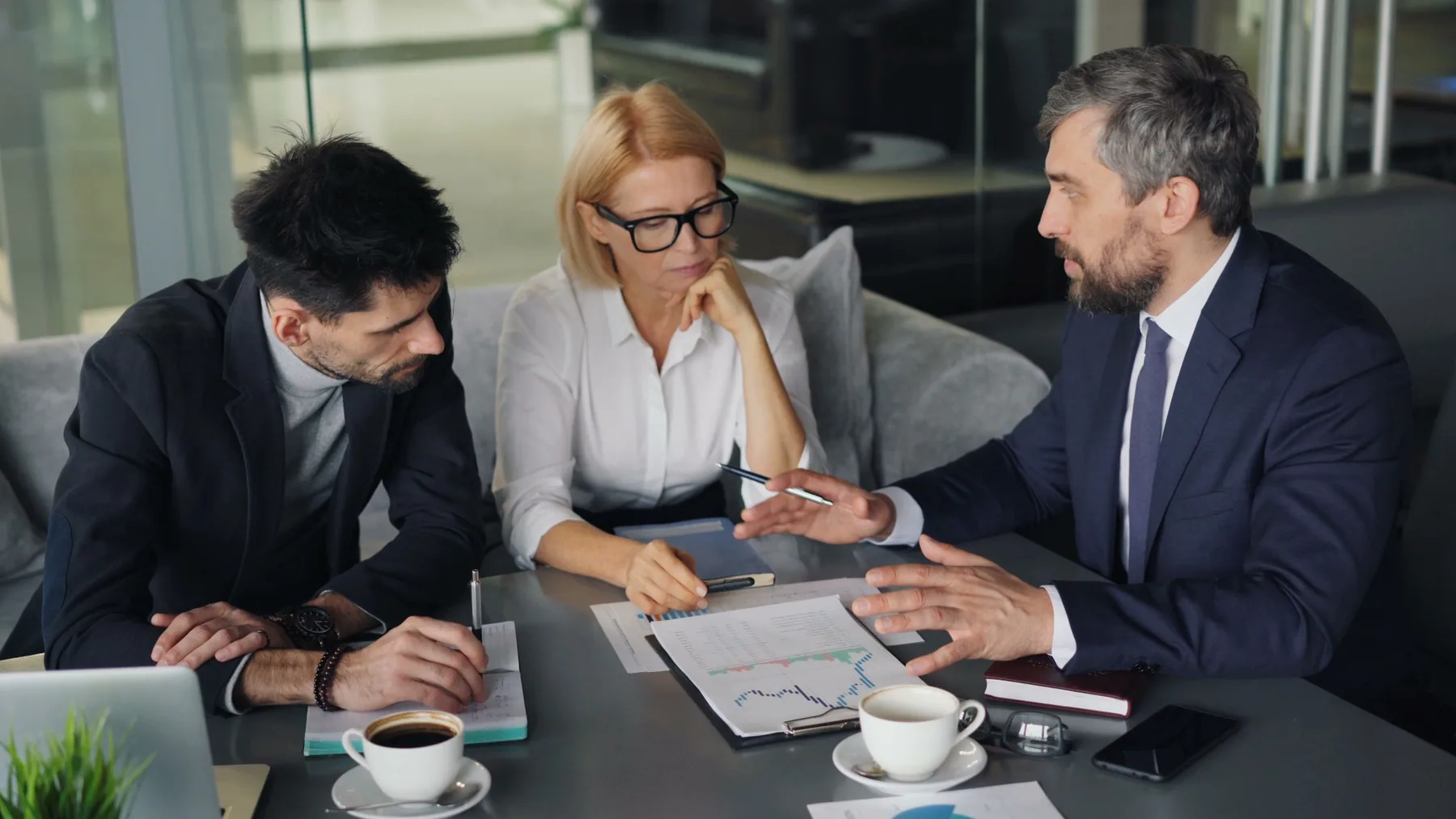 Professionals reviewing documents together during a career consultation meeting