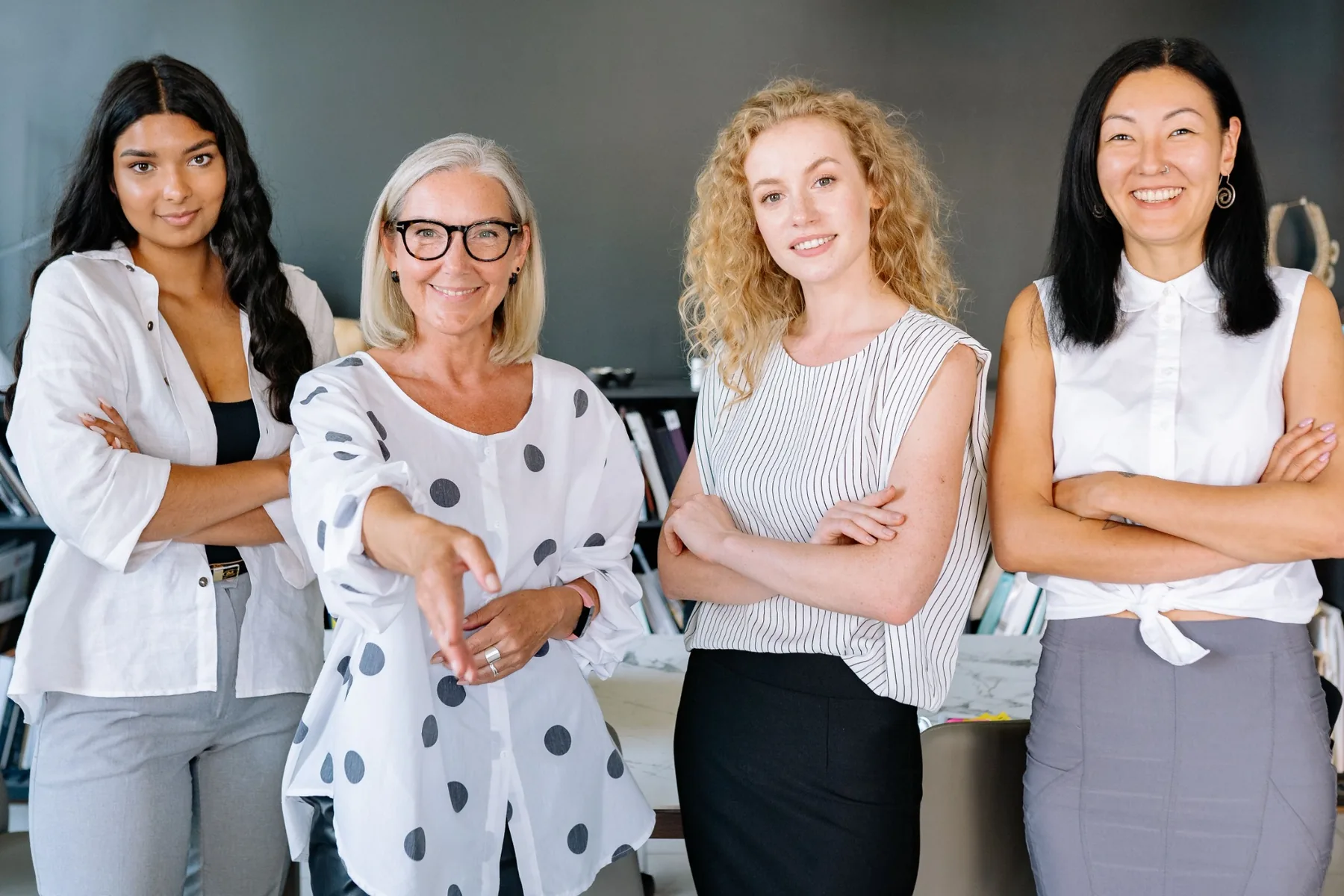 Professional women standing together in a workplace