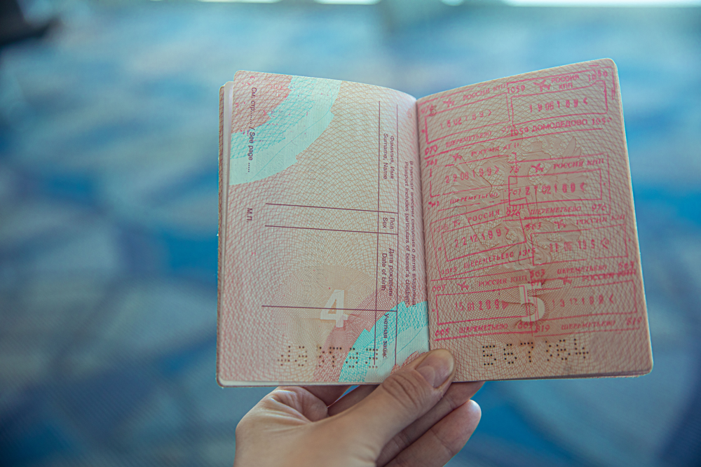 Generic travel document held during a travel preparation moment