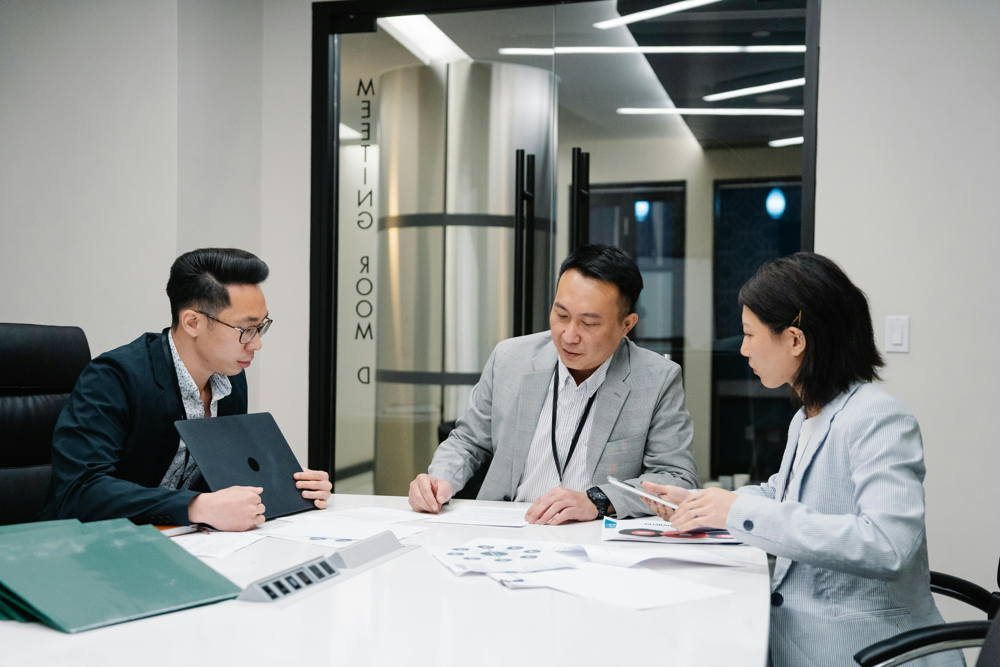 Employer and recruitment advisers reviewing workforce requirements